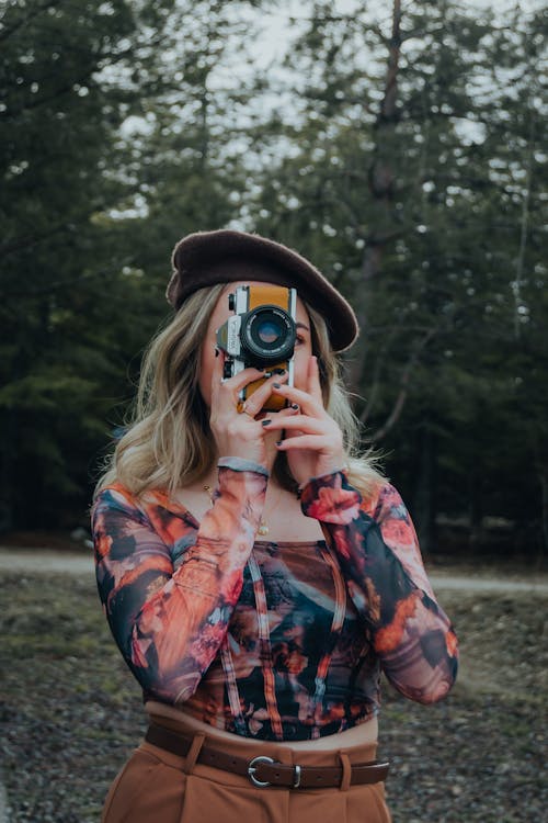 Blonde Woman Taking Pictures with Camera