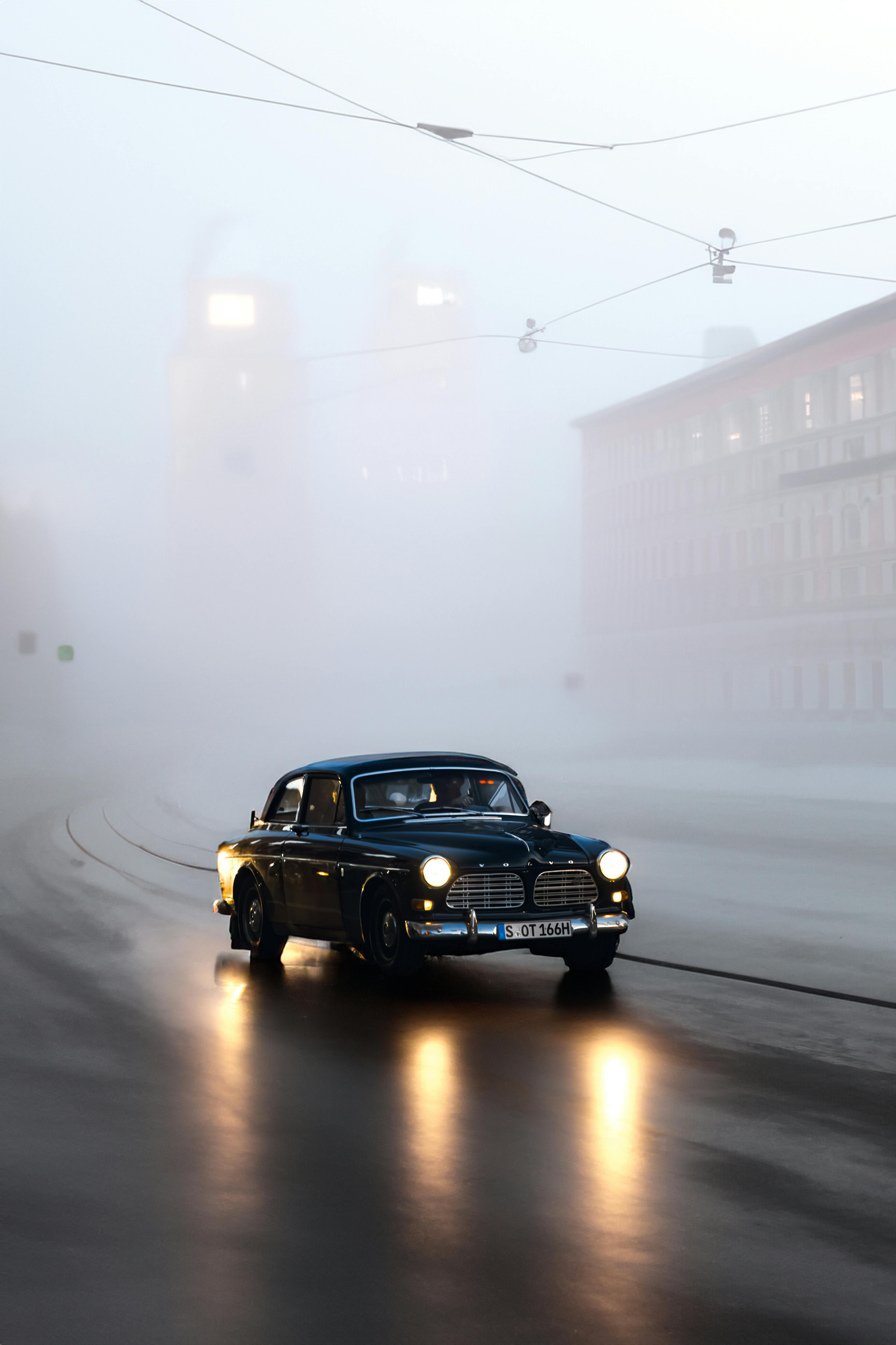 volvo amazon on street under fog