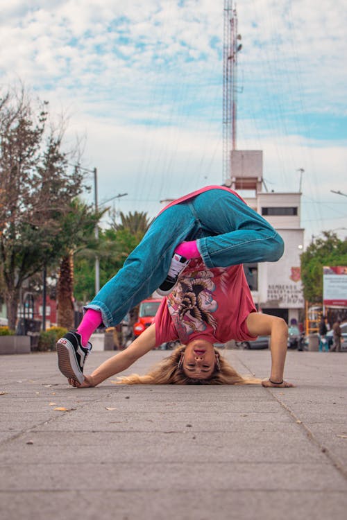 Woman Breakdancing on City Square · Free Stock Photo