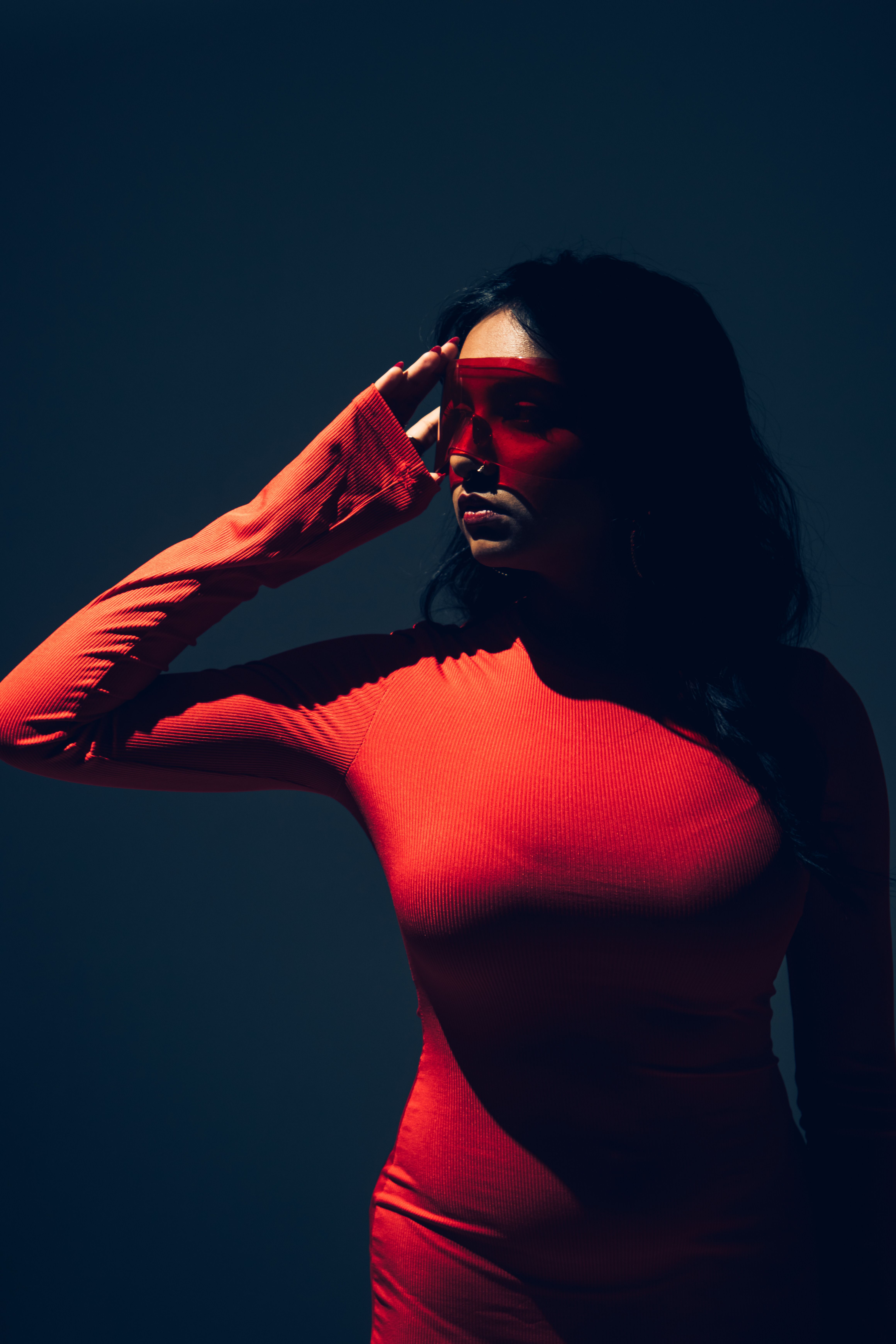Woman in Red Maxi Dress Posing in Darkness · Free Stock Photo