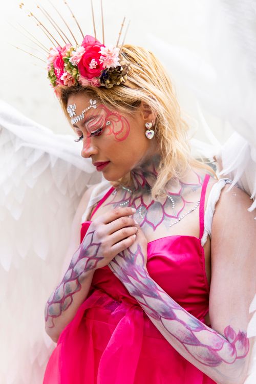Woman in Pink Dress with Makeup and Angel Wings  Free Stock Photo