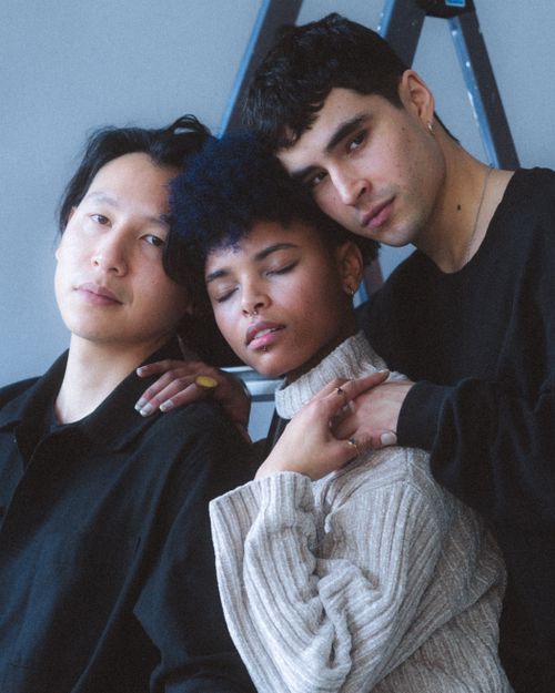 Free Three diverse friends embracing for an intimate group portrait shot. Stock Photo