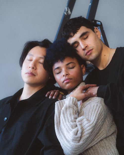 Free Multicultural group of friends embracing each other, eyes closed, expressing togetherness. Stock Photo