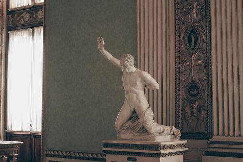 Free A dramatic marble sculpture displayed in a historic Florentine museum. Stock Photo