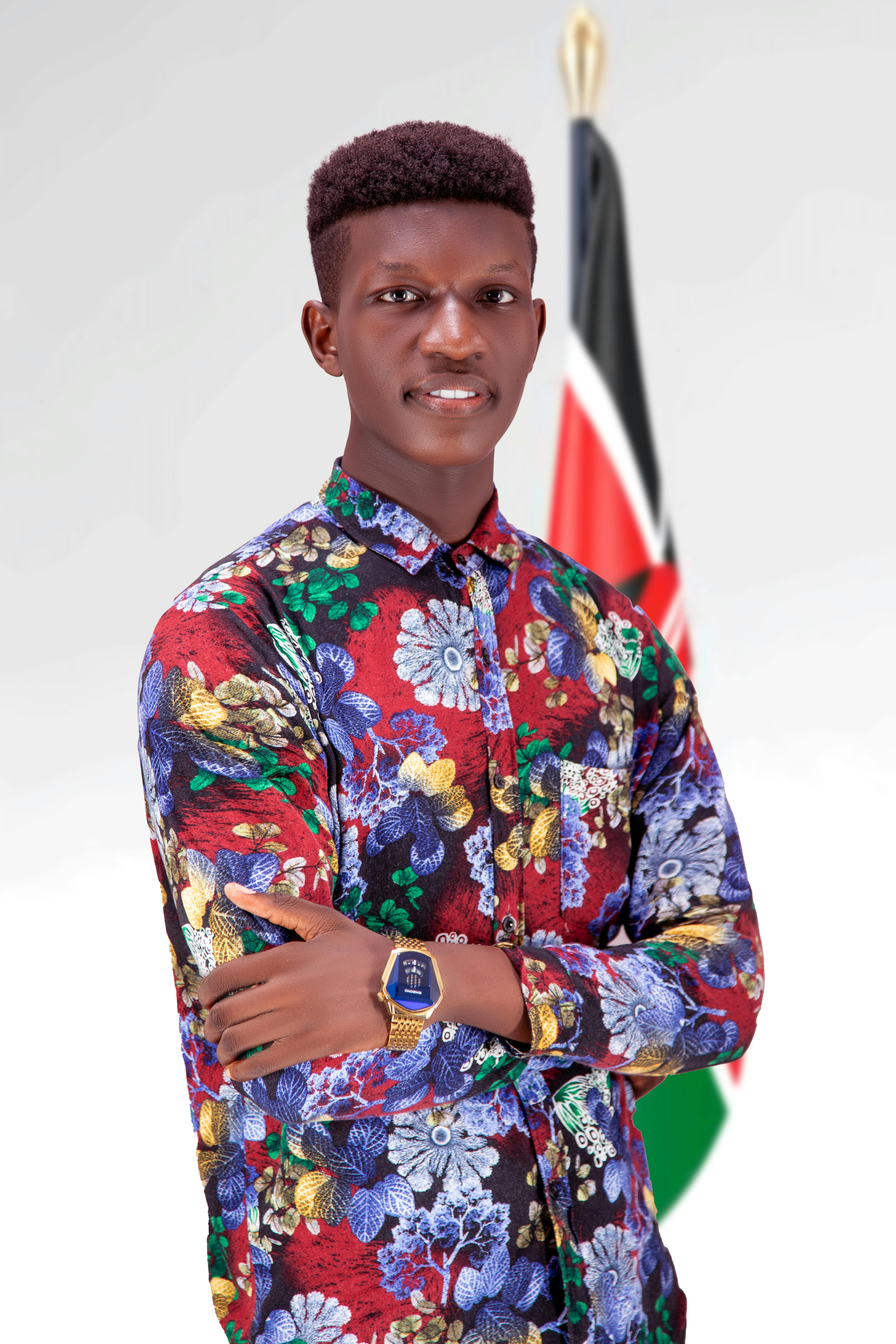 Confident man in vibrant floral shirt poses with Kenyan flag, showcasing style and nationality.