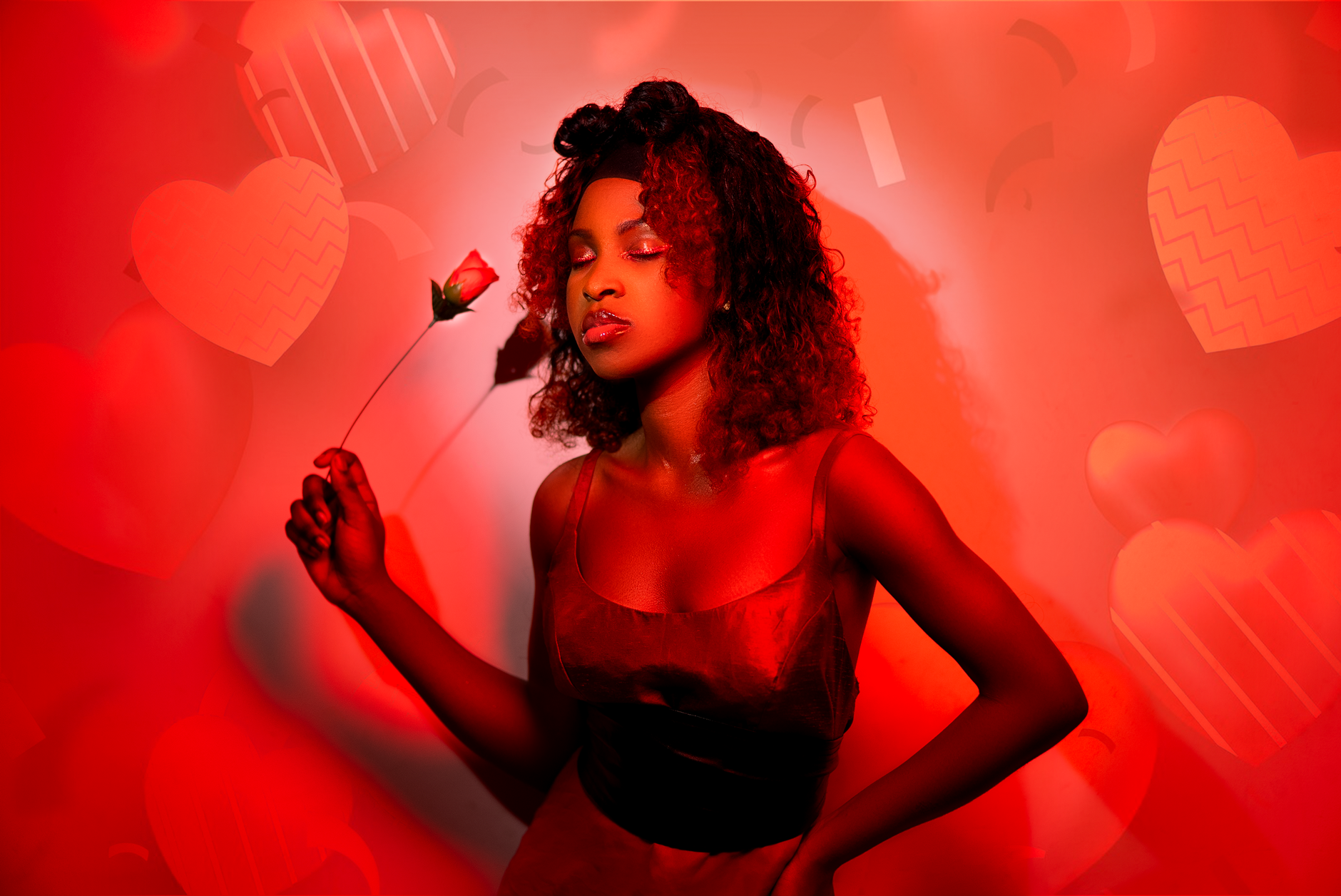 A beautiful portrait of a woman in red holding a rose, with a Valentine's Day theme.