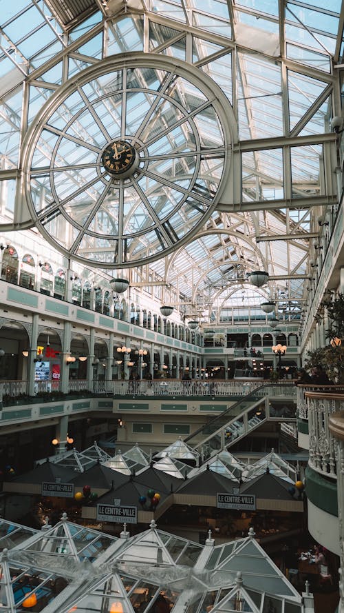The inside of a large building with a large glass roof