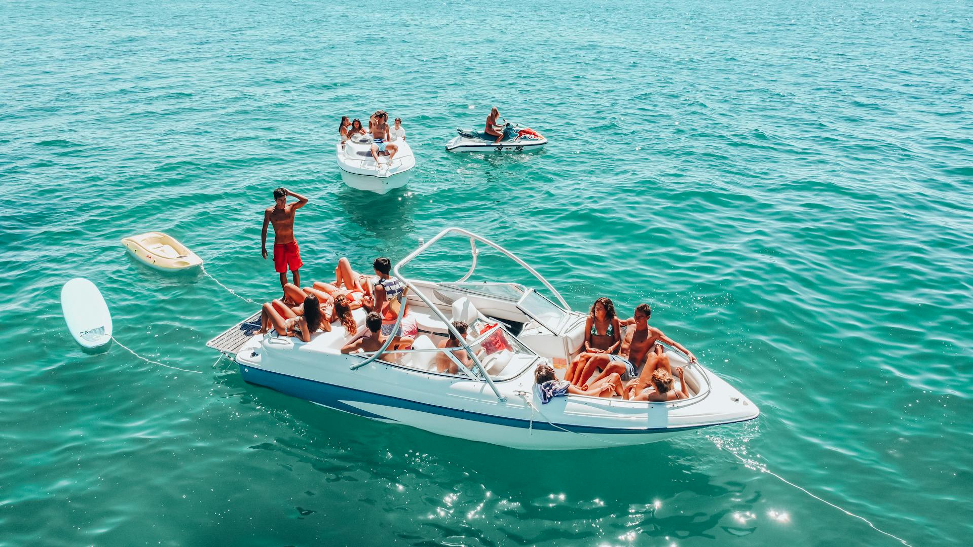 Friends having fun on motorboat in Dominican Republic