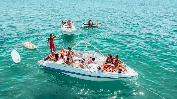 Friends Having Fun On Motorboat