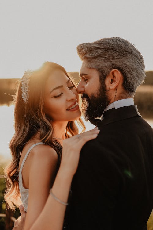 Happy Newlyweds Standing Close