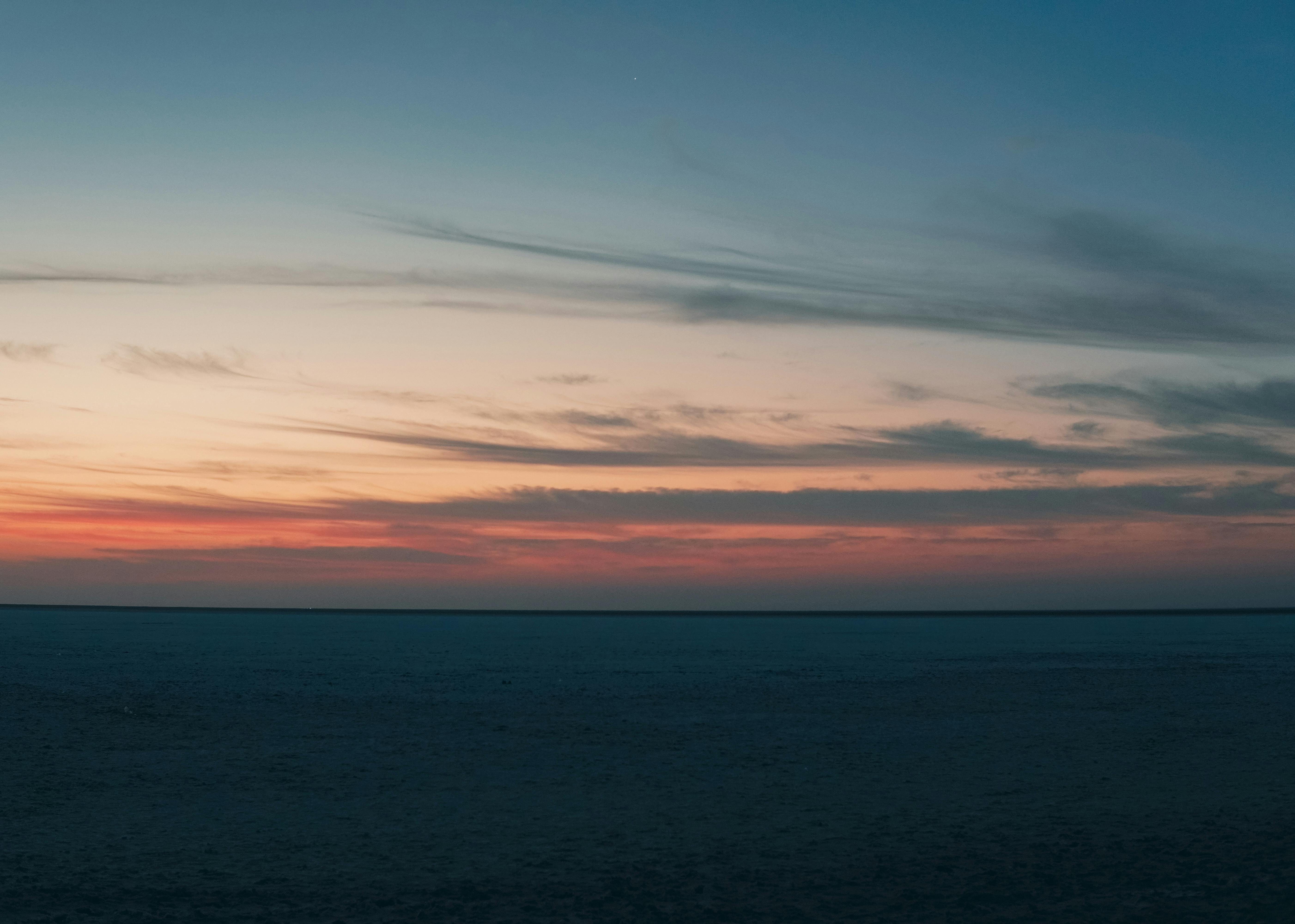 Breathtaking sunset view over the Rann of Kutch, capturing the tranquil dusk sky.