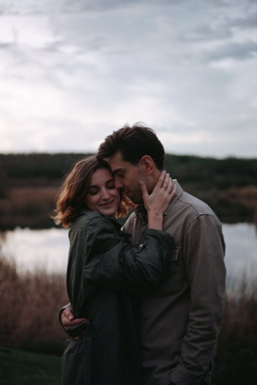 Couple Hugging By a Pond
