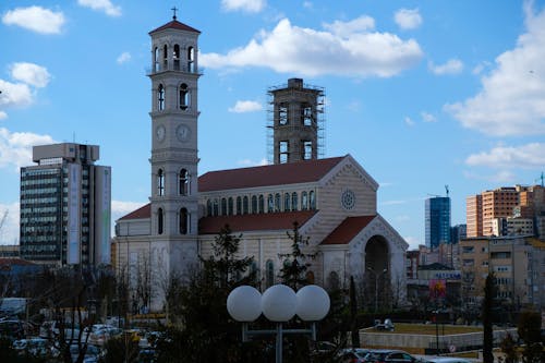 A church with a clock tower in the background