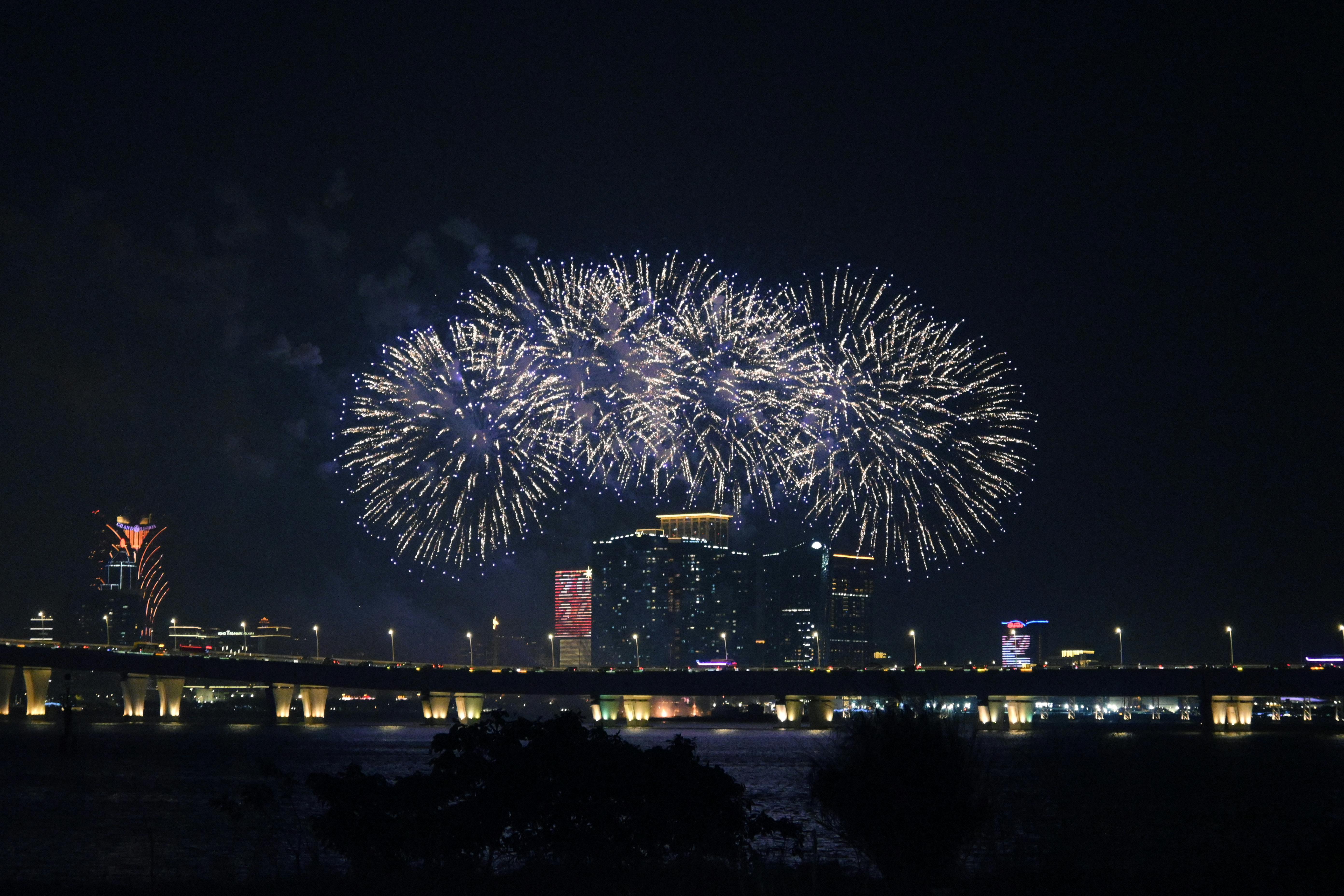 Spectacular night fireworks over a city skyline, capturing urban beauty and festive celebration.