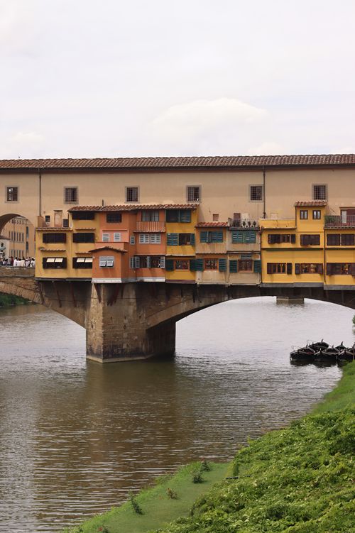 Free Scenic view of Ponte Vecchio spanning the Arno River in Florence, Italy on a summer day. Stock Photo
