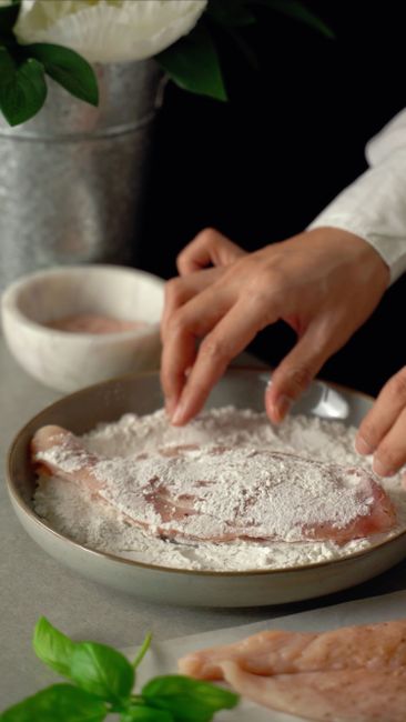 Dredging means coating food lightly in a dry ingredient, usually the first step in a multi-step breading. How it works and why it matters.