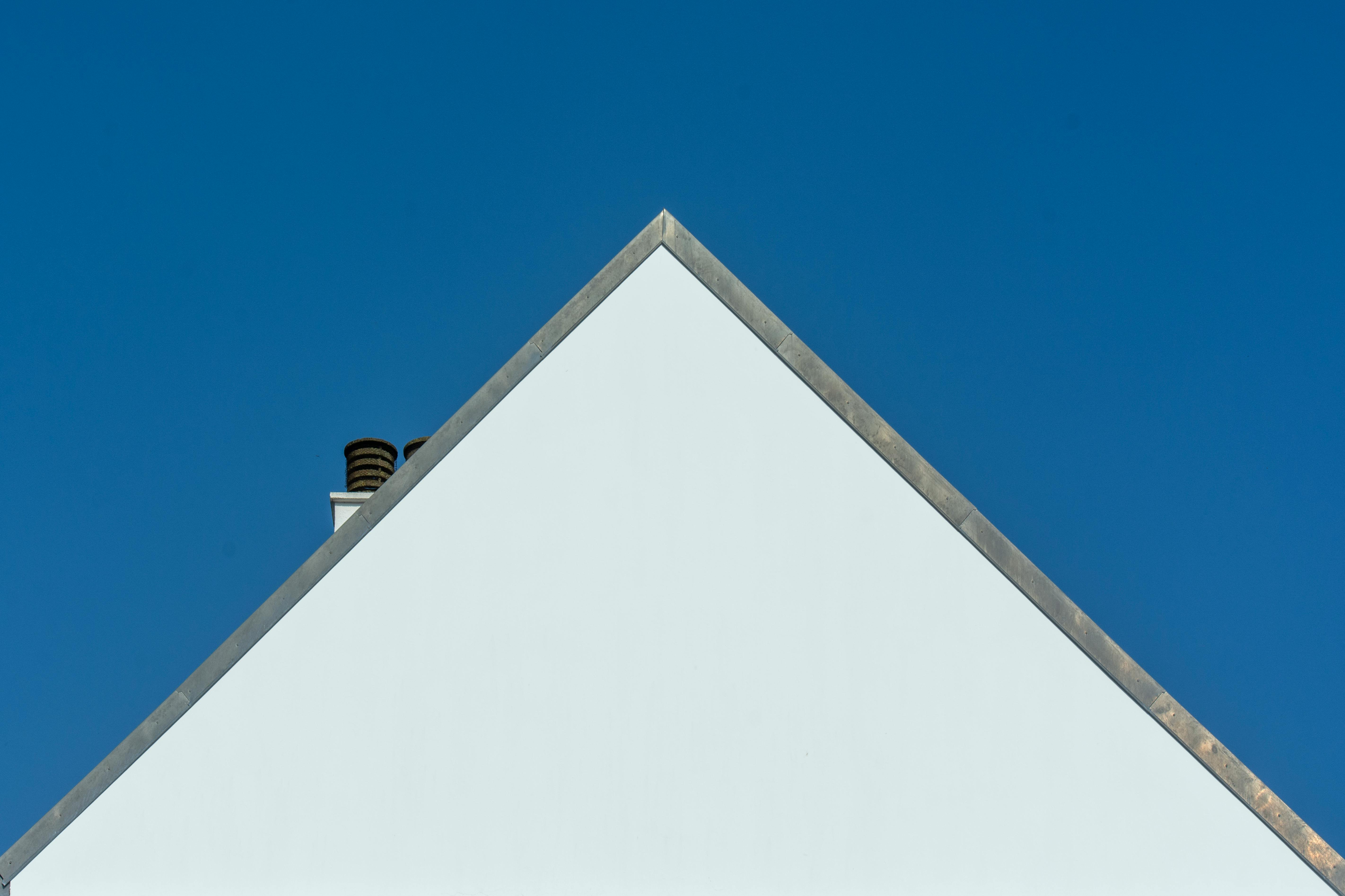 White Gable House Against Blue Sky