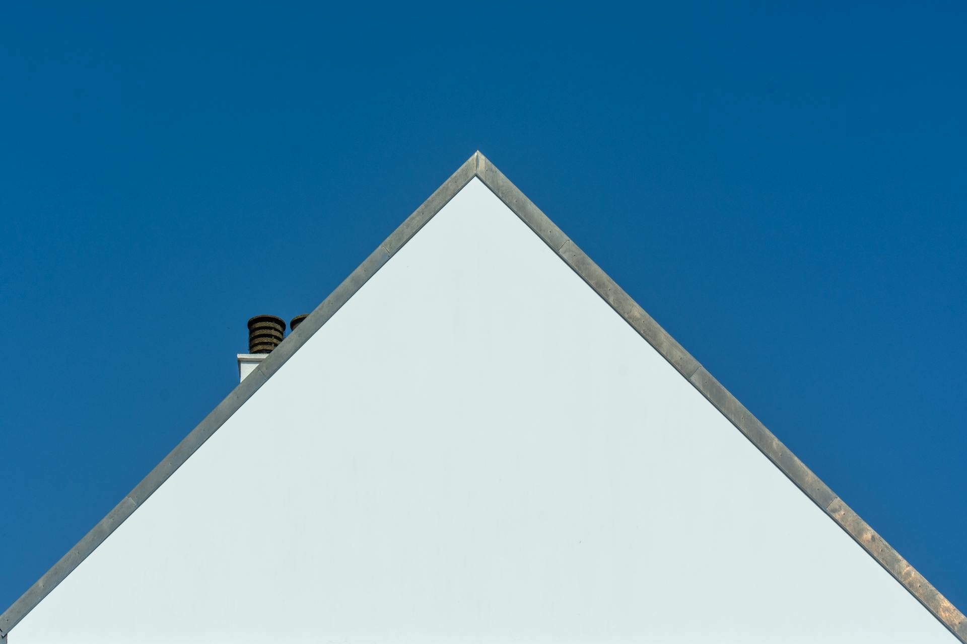 White Gable House Against Blue Sky