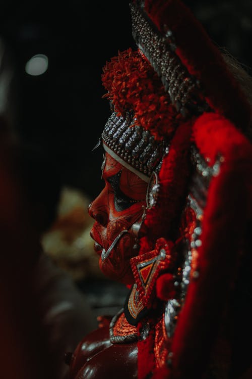 Person with Red Makeup in Buddhist Makeup