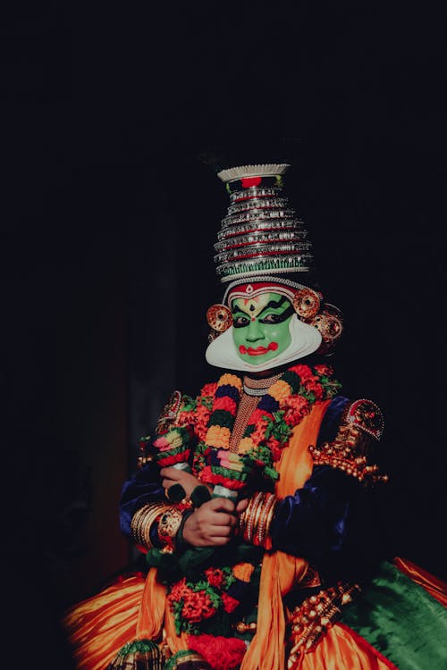 Person in Traditional Clothing with Mask