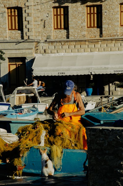 Fisherman Repairing the Fishnet