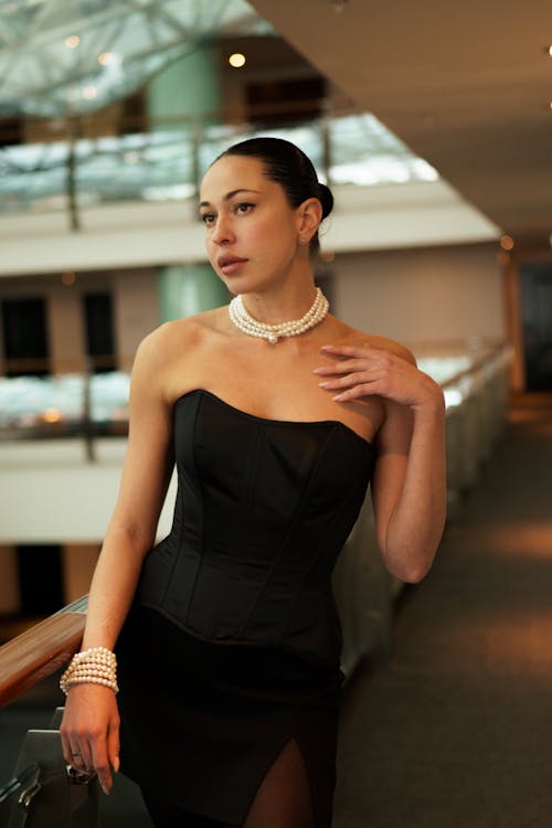 Woman Wearing Pearls to Corset 