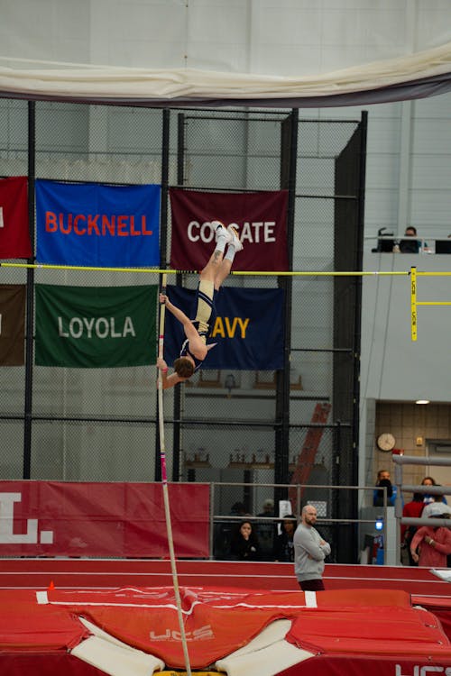 Man Jumping during Pole Vaulting Competition