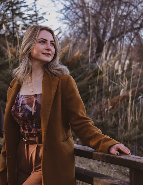 Blonde Wearing Coat in Park