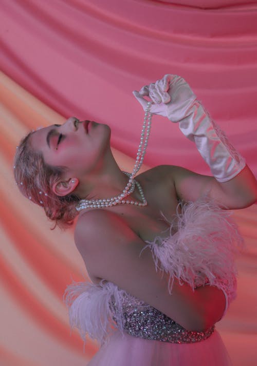 Woman Posing in Ball Gown with White Boa, and Silk Gloves