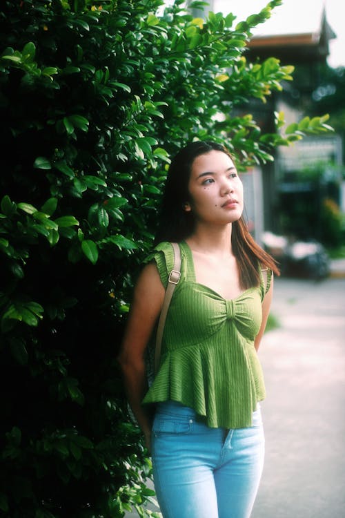 Woman in Jeans and Green Blouse