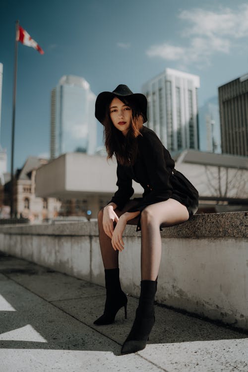 A Young, Fashionable Woman Posing in City 