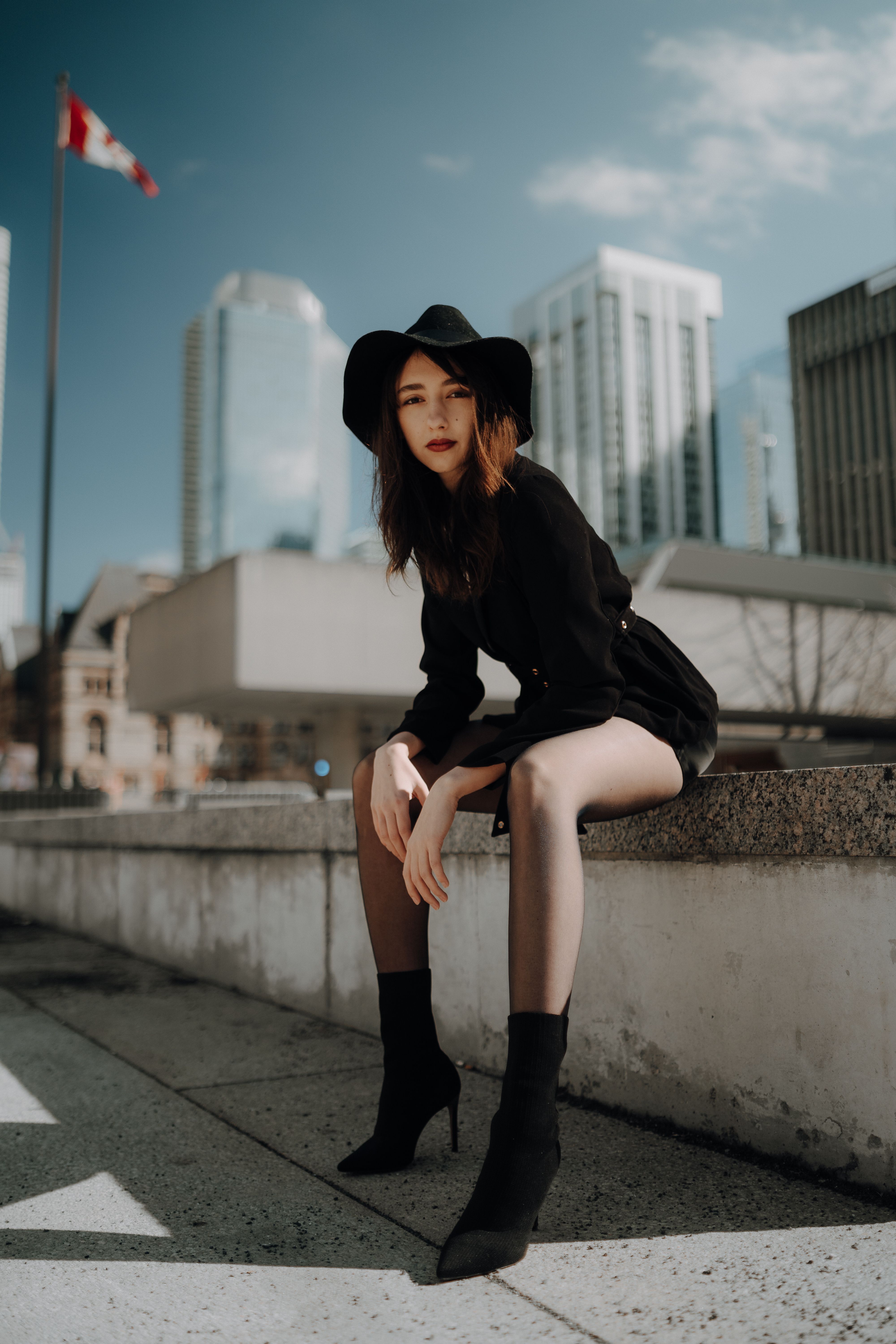 A Young, Fashionable Woman Posing in City · Free Stock Photo