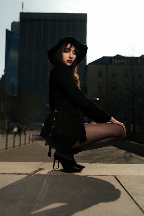 A Young, Fashionable Woman Posing in City 