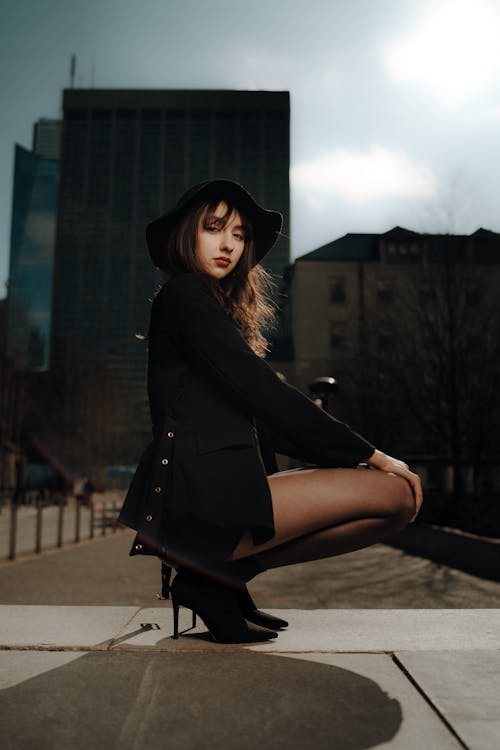 Free A Young, Fashionable Woman Posing in City  Stock Photo