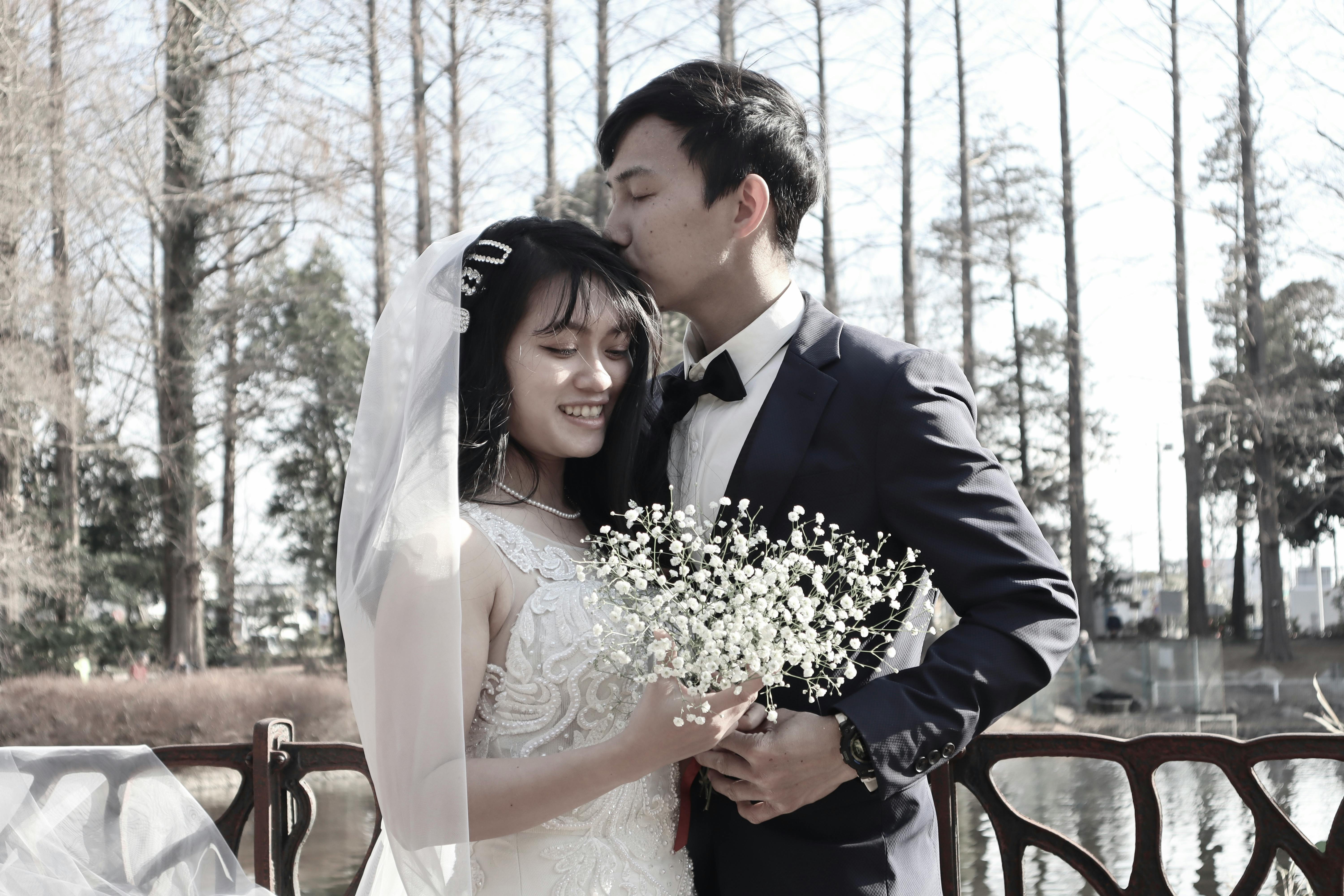 Elegant outdoor wedding portrait of a couple embracing in Tokorozawa, Japan.