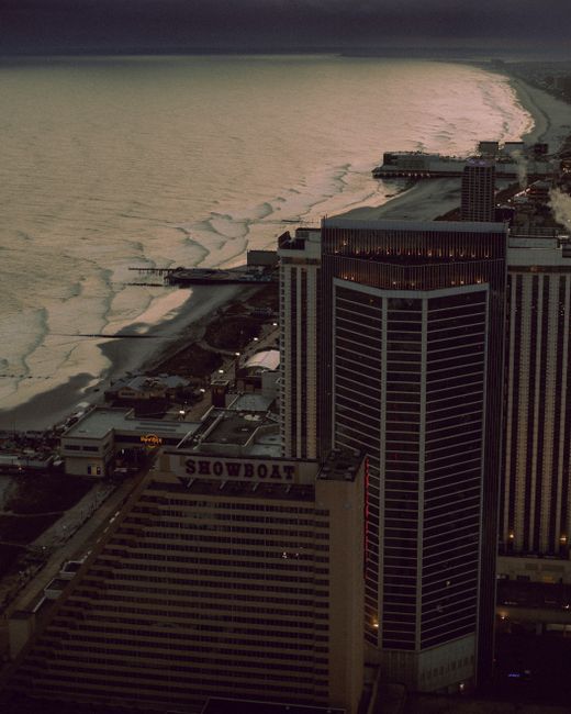 Dramatic aerial view of Atlantic City's skyscrapers along the coast during dusk.
