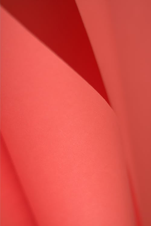 A close up of a red paper with a pattern