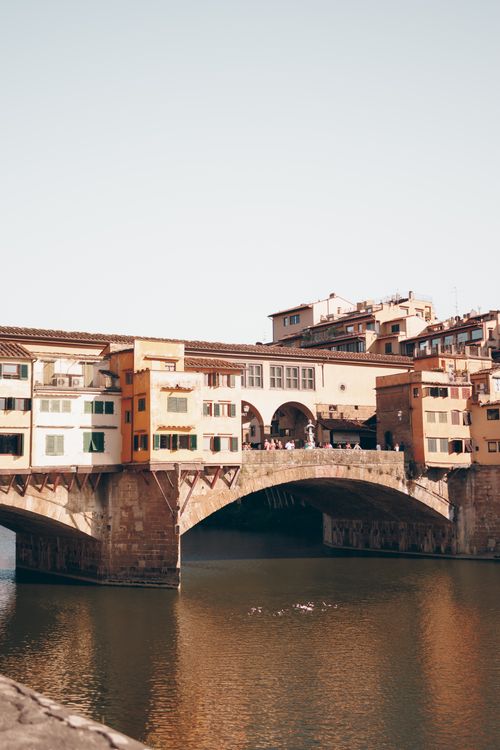 Free A stunning view of Ponte Vecchio over the Arno River in Florence, Italy. Stock Photo