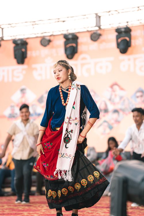 Free Traditional dance performance at cultural festival featuring women in ethnic attire. Stock Photo