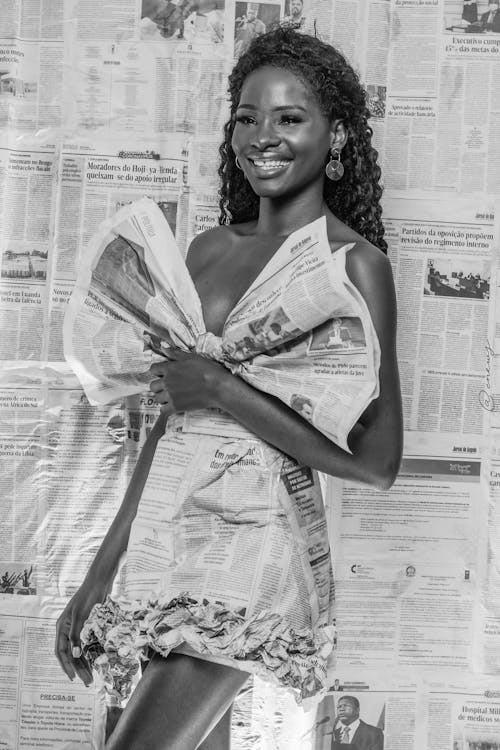 Smiling Woman in Newspapers Dress
