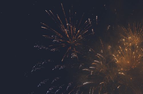 Free Vibrant fireworks light up the dark night sky, capturing the essence of celebration and festivity. Stock Photo