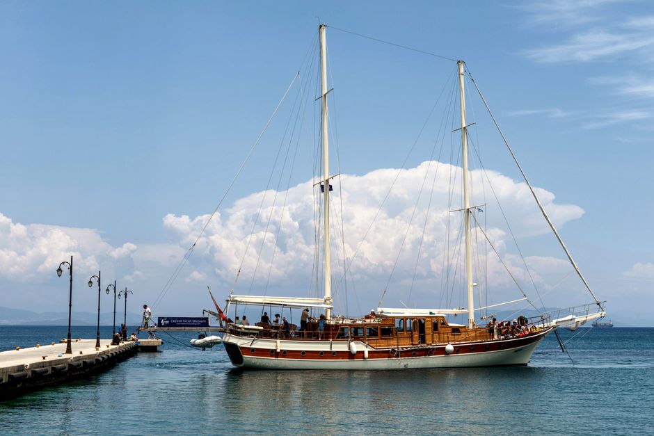 Unforgettable Full Day Naxos Exploration Yacht Tour Review: 7 Hours of Greek Island Paradise Review 2026 - Elegant sailing ship moored at a pier on a sunny day in Kos, Greece, ideal for travel and tourism.