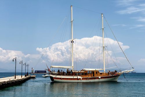 Free Elegant sailing ship moored at a pier on a sunny day in Kos, Greece, ideal for travel and tourism. Stock Photo