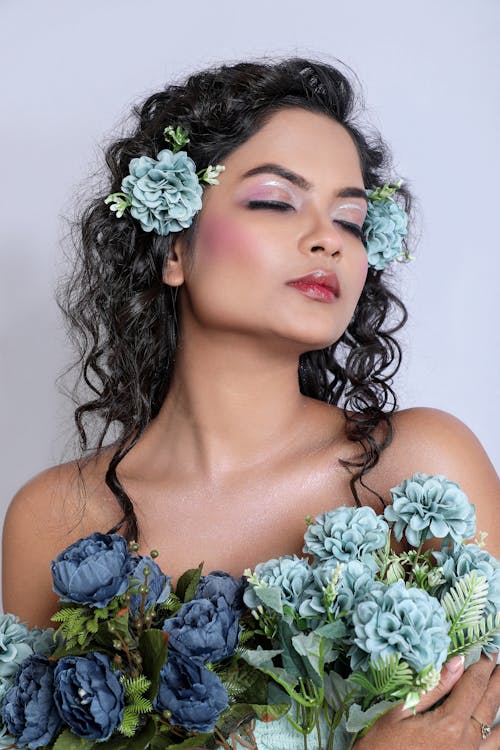 Foto profissional grátis de cabelo cacheado, flora, flores