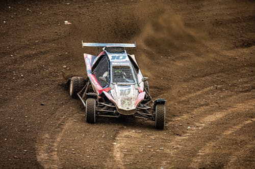 Free A dirt car racing down a dirt track Stock Photo