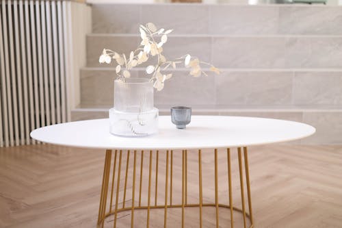 White Minimalist Table With a Vase and a Cup