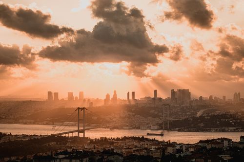 Free Panoramic view of Istanbul skyline at sunset with Bosphorus Bridge in foreground. Stock Photo