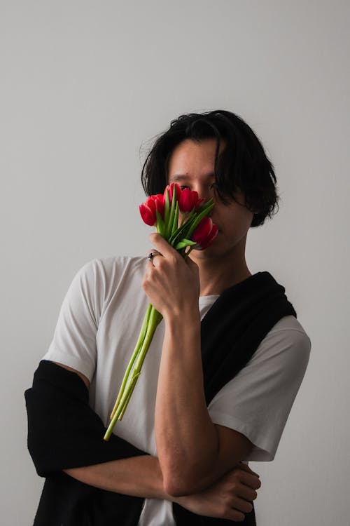 Man Holding Red Tulips 