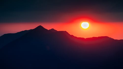 Silhouette of Mountain Valley During Sunset