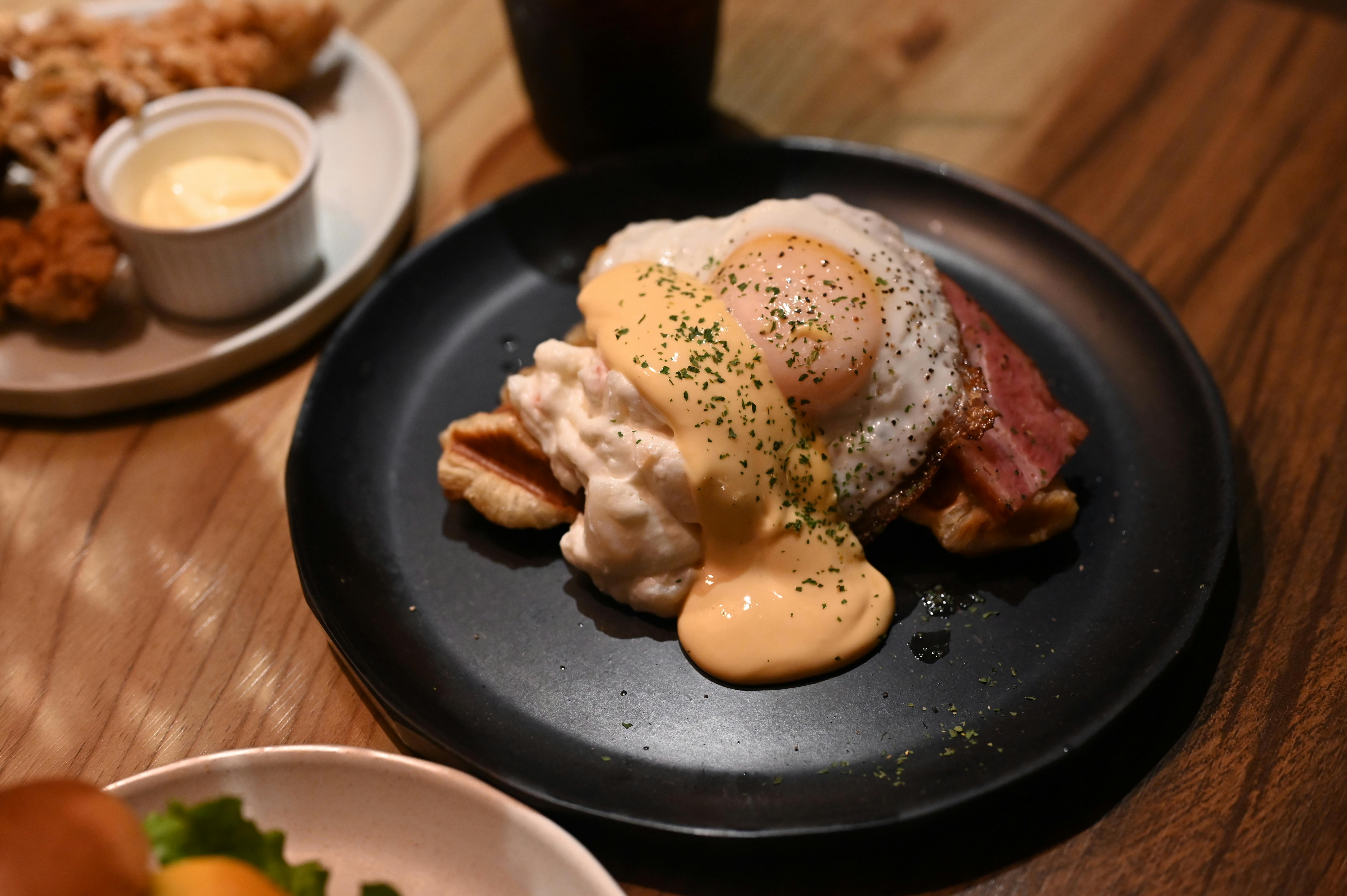 A plate with eggs and bacon on it